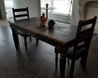vintage rustic table with two chairs