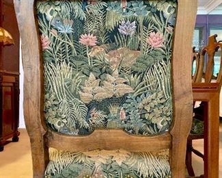Detail of dining armchair upholstered in Rousseu inspired print.