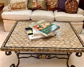 Wrought iron coffee table with travertine top