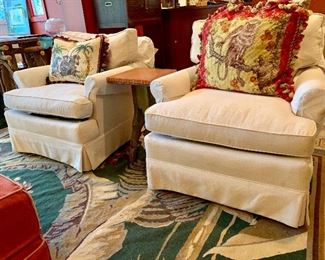 Pair of club chairs, needlepoint pillows with monkey motif