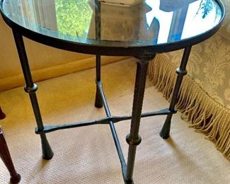 Wrought iron table with glass top.  22 inches round.