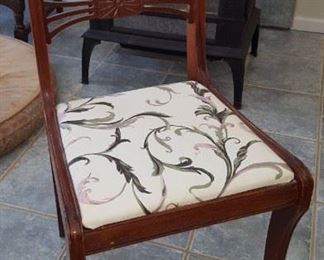 One of two chairs that go with the table