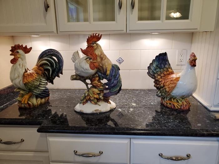 Center is Capodimonte Rooster and Hen. Flanked by ceramic Rooster and Hen figurines.