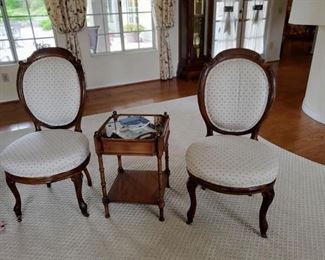 Antique Victorian parlor chairs and glass topped collectibles display table