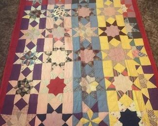 Hand done vintage quilt with red cotton back. Nice pattern. Good stitching. Great vintage fabric that has held up very nicely. This beauty has been stored for years. Star pattern.