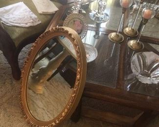 a gold leaf Oval Mirror ready to hang. 