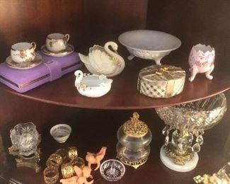 another view of the shelves- ring stand, oriental cups, hand painted cups. beautiful hand painted mugs and desert plates