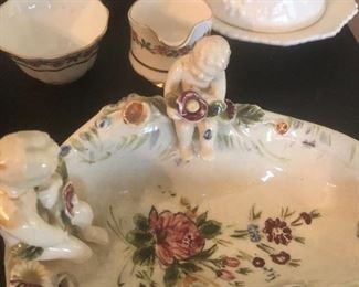 two cherubs on this hand painted beauty from Italy