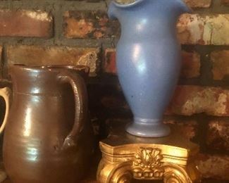 crockware and pottery on the mantel
