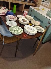 collector plates and mid century table with leaf