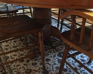 Solid pedestal base under table.  Rug for sale, too.