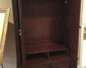Inside armoire for TV, DVD, and VHS players.