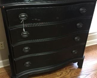 Black chest of drawers.