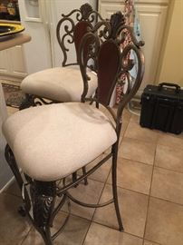 Pair of these metal bar stools with cloth seats.