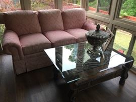 Beautiful sofa, glass top coffee table.