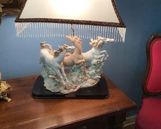 One of a pair of large Capo di Monte horse figural groups mounted as lamps