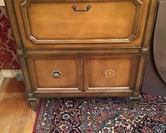 Exterior of bar cabinet, detail of Tabriz design handmade wool carpet 9’x12’