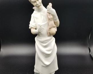 Lladro male doctor figurine with newborn baby