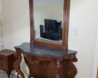 marble-topped accent table and mirror