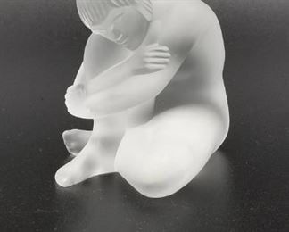 Lalique man hugging one knee figurine