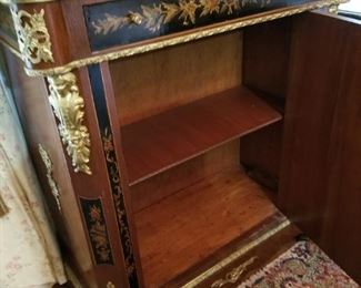 Ornate marble-topped cabinet (dining) - shown here with door open.