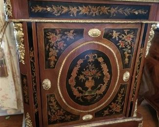 Ornate marble-topped cabinet (dining)