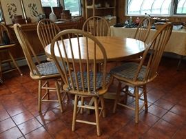 Nice butcher block style round table and six swivel chairs 