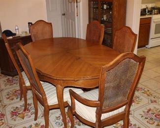 dining table and six chairs. shown without the three leaves. also table cover