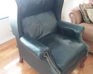 Dark blue leather wing backed chair