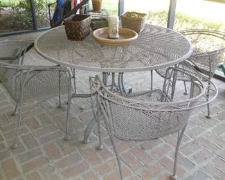 Round metal table and four chairs
