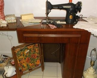 Singer sewing machine in vintage cabinet