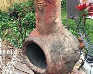 Clay Chiminea with Stand
Large Collection Of Iron Plants Stands, Hanging Baskets, Pots, Wind Chimes and Statuary