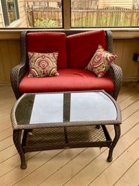 Cute outdoor rattan loveseat and cocktail table
