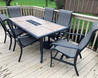 This outdoor dining set comes with 6 chairs and an umbrella just in time for dining al fresco!