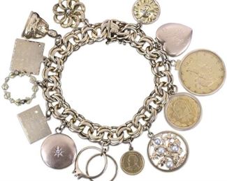 LOT #5084 - 14KT YELLOW GOLD CHARM BRACELET W/ (13) CHARMS