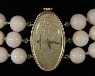 LOT #5223 - LADY'S CORAL BEADED 14KT BAUME MERCIER SWISS WATCH