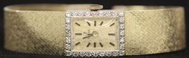 LOT #5321 - LADY'S DIAMOND 14KT GOLD OMEGA WRISTWATCH