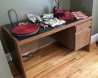 Perfect desk for yourself or a student! Mixture of linens, metal candle holders and more
