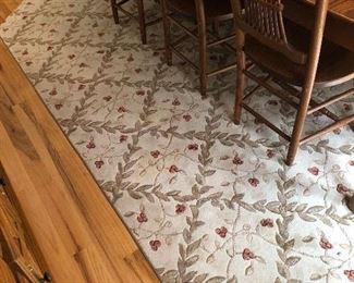 Super clean, vines and berries rug.