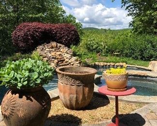 Large flower pots and red table! Blue sky...free!