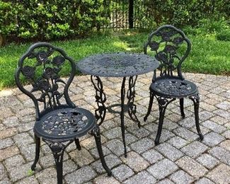 Metal table and two matching chairs.