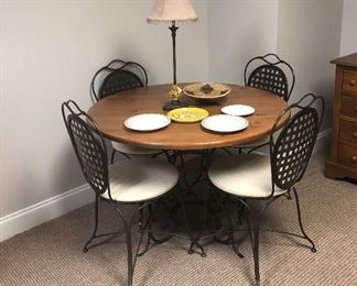 Nice heavy metal table with four matching chairs.