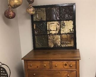 Hartford House 5 drawer chest, has a top matching piece for hanging clothes. We will have a picture of it soon. Also painted gourds, and tin picture.