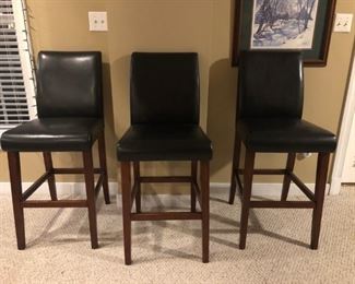 3 tall dark leather bar stools