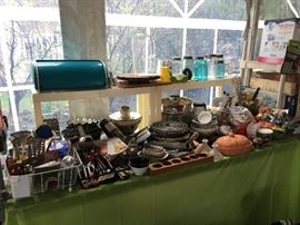 Utensils & a turquoise bread box.