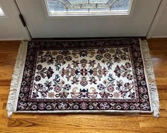 Small, hand knotted,100% virgin wool rug.