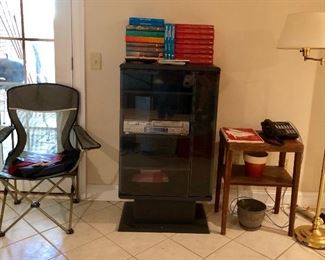 Folding chair, retro stereo cabinet, floor lamp, small table,  plus more. 