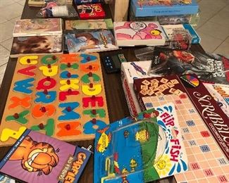 Toys, books and games include scrabble, Angry Birds "Knock on Wood" game, Pink Panther cartoon collection, double six dominoes, build a bug, Scrabble Junior, puzzles, electronic snap circuits, Yamslam, marbles, Learning games etc.