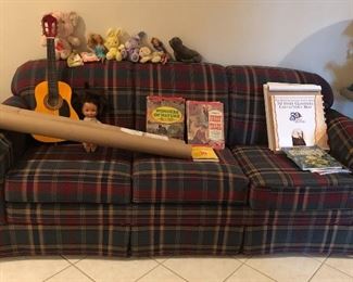 La-z-Boy Plaid sleeper sofa, child’s guitar, Barbies, books, Care Bear...