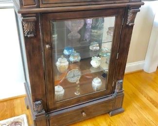 Has lower light and shelving to display your favorite treasures